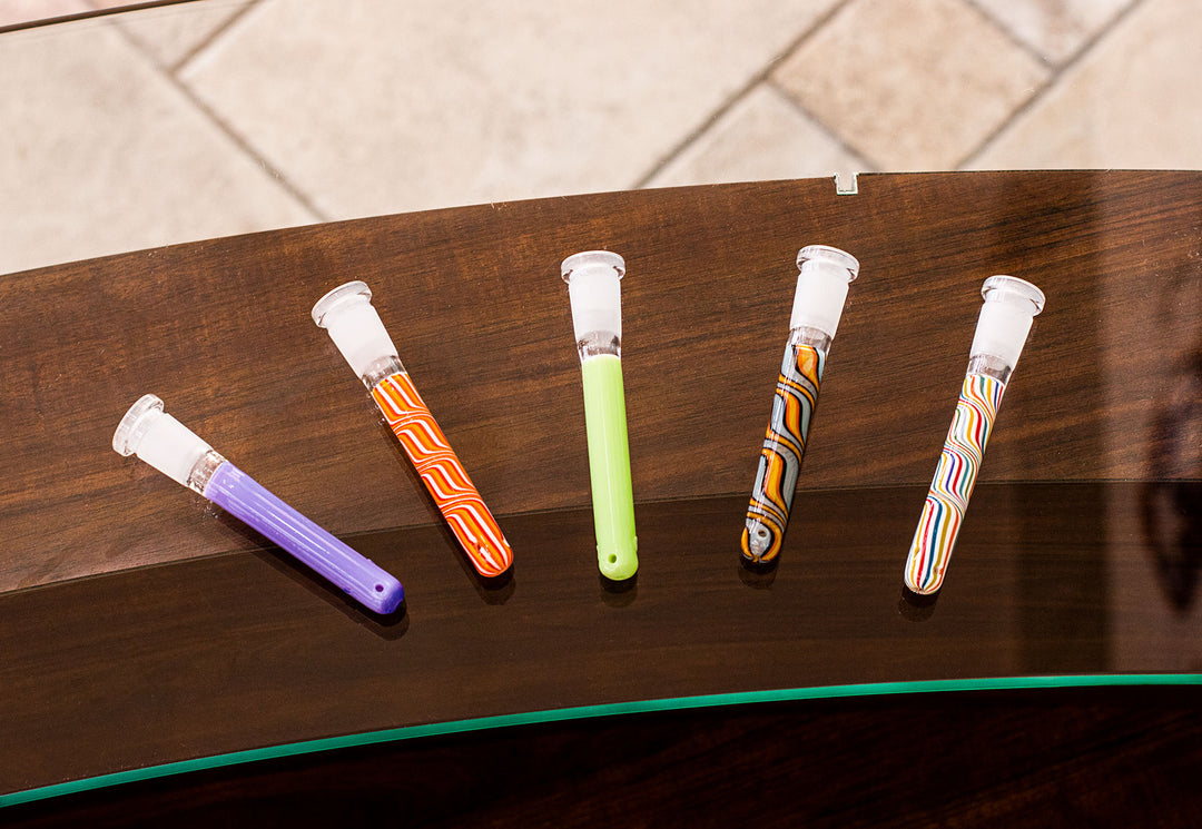 Wholesale Downstems various colors aligned in a row on top of a glass and wood table inside office building