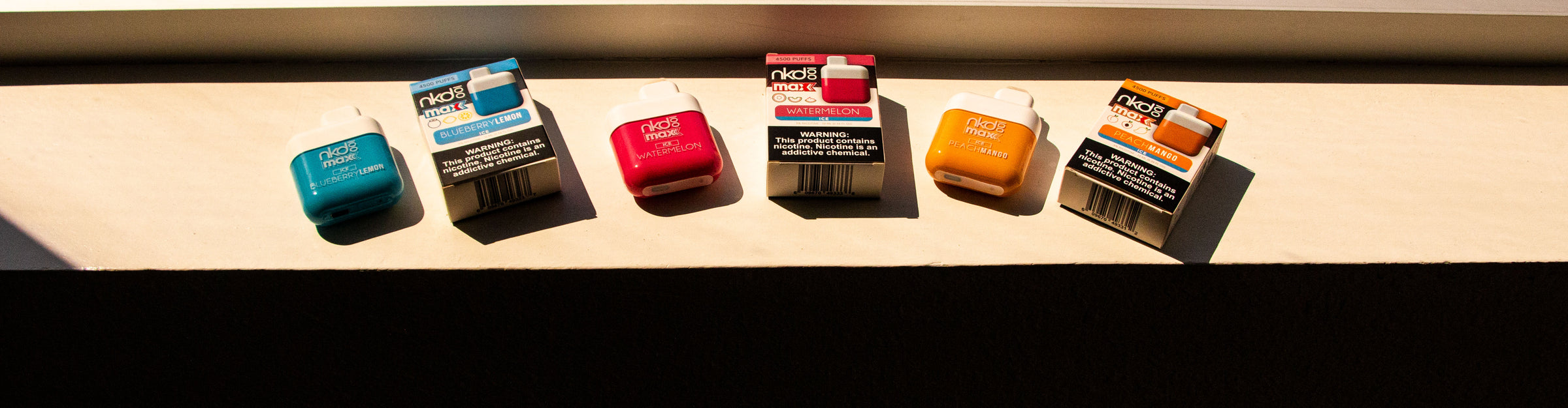 Wholesale Naked 100 products lined up in a row on window ledge inside office